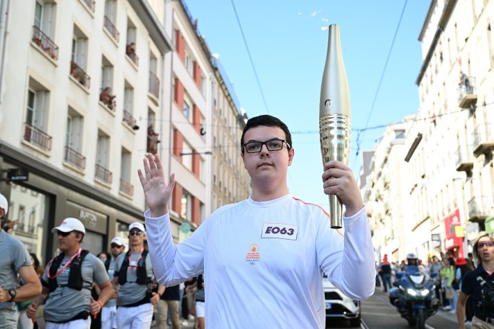 ryann portant la flamme olympique